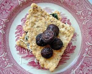 Hazelnut crackers stacked with chard and roasted mushrooms