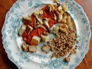 Roasted potatoes, cauliflower and butterbeans with spicy red pepper sauce