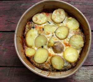 Potatoes layered with kale, artichoke hearts and pesto ricotta.
