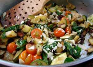Zucchini and spinach with olives and almonds
