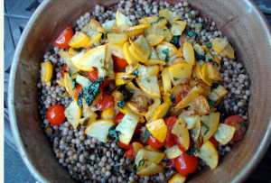 Pearled couscous and french lentils with yellow squash, tomatoes and fresh herbs