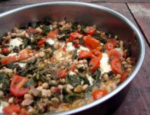 Kale with white beans, raisins and tomatoes