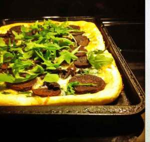 Purple sweet potato pizza with arugula