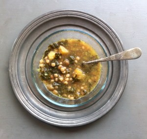 Pigeon pea soup with pearled couscous and collards