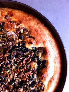 Savory cake with chard, mushrooms, pecans and pistachios