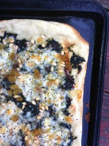 Pizza with chard, pine nuts and golden raisins